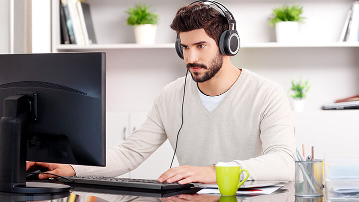 Man doing some work on his home computer