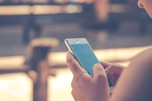 A woman texting on her cellphone