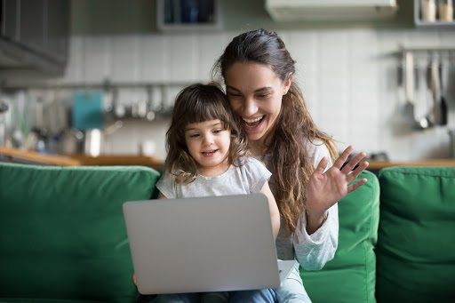 Mom and daughter looking at laptop